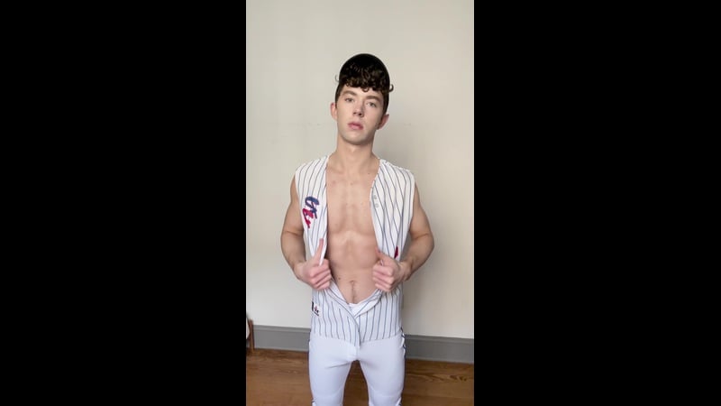 Christopher Walsh shows off jockstrap after baseball practice, feeling his body
