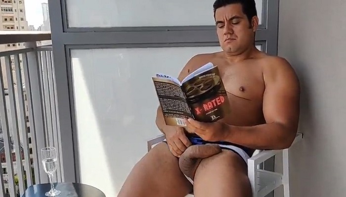 Yuri Gaucho Jerks Off on Balcony Reading Book